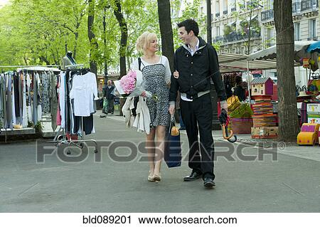 Caucasian couple at market View Large Photo Image Stock Image - Caucasian couple at market. Fotosearch