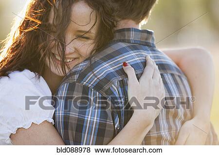 Caucasian couple hugging View Large Photo Image Stock Photo - Caucasian couple hugging. Fotosearch