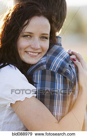Stock Photo - Caucasian couple hugging. Fotosearch