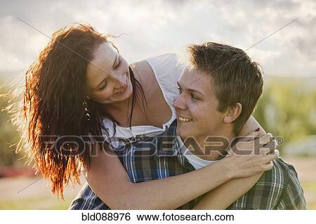 Caucasian man giving girlfriend piggyback ride View Large Photo Image Stock Photograph - Caucasian man giving girlfriend piggyback ride. Fotosearch