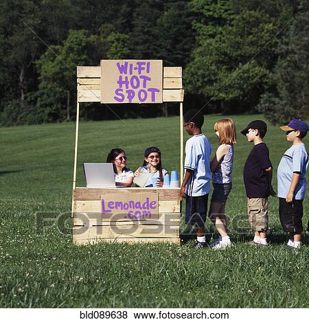 Stock Photo - Children with wi-fi enabled lemonade stand. Fotosearch