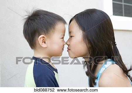 Chinese brother and sister staring at one another View Large Photo Image Stock Image - Chinese brother and sister staring at one another. Fotosearch