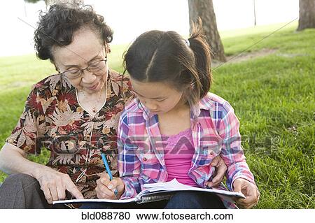 Chinese grandmother watching granddaughter doing homework View Large Photo Image Stock Image - Chinese grandmother watching granddaughter doing homework. Fotosearch