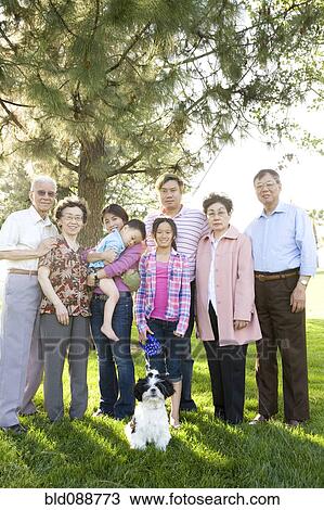 Chinese multi-generation family standing together outdoors View Large Photo Image Stock Image - Chinese multi-generation family standing together outdoors. Fotosearch