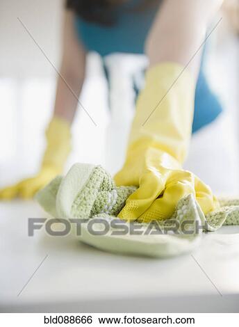 Close up of Korean woman wiping counter View Large Photo Image Stock Photograph - Close up of Korean woman wiping counter. Fotosearch
