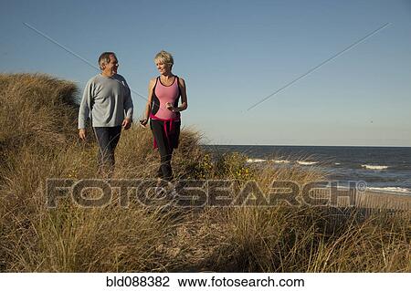 Couple exercising near ocean View Large Photo Image Stock Image - Couple exercising near ocean. Fotosearch