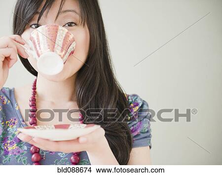 Elegant Korean woman drinking coffee View Large Photo Image Picture - Elegant Korean woman drinking coffee. Fotosearch
