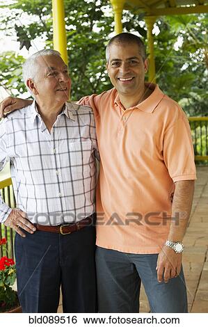 Father and son hugging on porch View Large Photo Image Stock Photograph - Father and son hugging on porch. Fotosearch