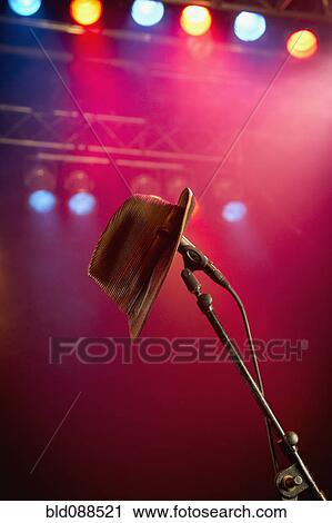 Fedora hanging on microphone on stage View Large Photo Image Stock Image - Fedora hanging on microphone on stage. Fotosearch