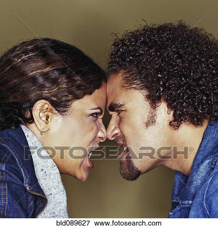 Stock Photo - Grimacing couple having argument. Fotosearch