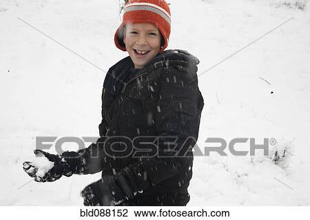 Hispanic boy throwing snowballs View Large Photo Image Stock Image - Hispanic boy throwing snowballs. Fotosearch