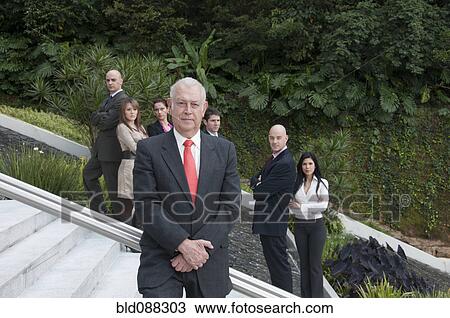 Hispanic business people standing on stairs together outdoors View Large Photo Image Stock Image - Hispanic business people standing on stairs together outdoors. Fotosearch