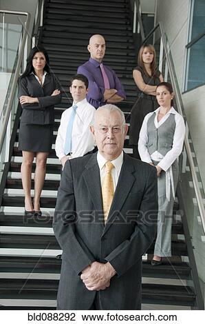 Hispanic business people standing together on staircase View Large Photo Image Stock Image - Hispanic business people standing together on staircase. Fotosearch