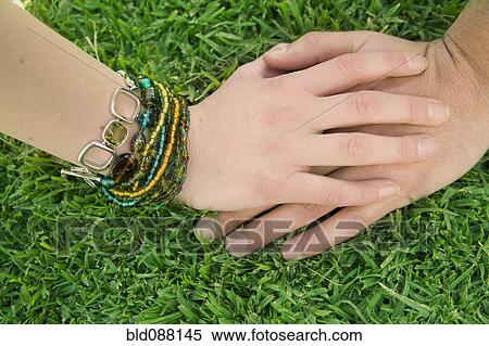 Hispanic couple holding hands View Large Photo Image Stock Photography - Hispanic couple holding hands. Fotosearch