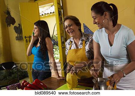 Hispanic family cooking together View Large Photo Image Stock Image - Hispanic family cooking together. Fotosearch
