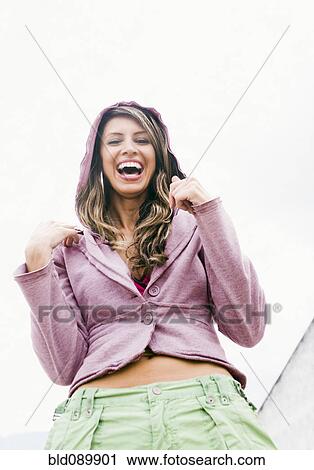 Stock Image - Hispanic woman laughing. Fotosearch