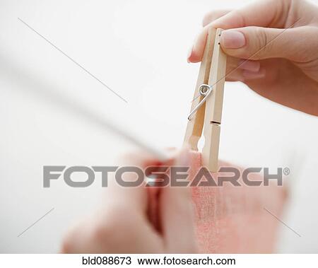 Korean woman hanging clothing on clothes line View Large Photo Image Stock Image - Korean woman hanging clothing on clothes line. Fotosearch