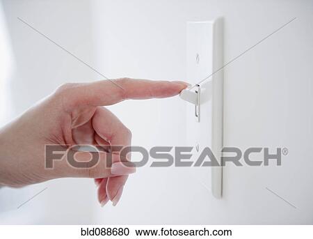 Korean woman turning off light switch View Large Photo Image Stock Image - Korean woman turning off light switch. Fotosearch