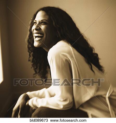 Laughing woman leaning View Large Photo Image Stock Image - Laughing woman leaning. Fotosearch