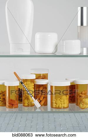 Medicine cabinet with pill bottles and syringe View Large Photo Image Stock Image - Medicine cabinet with pill bottles and syringe. Fotosearch
