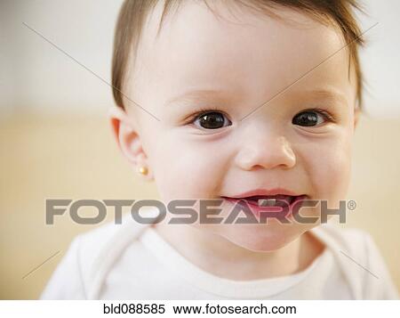Stock Photography - Mixed race baby smiling. Fotosearch