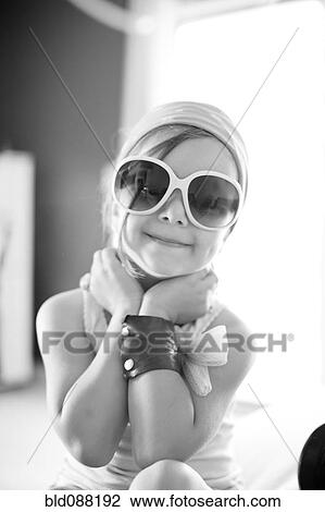 Mixed race girl wearing sunglasses View Large Photo Image Stock Image - Mixed race girl wearing sunglasses. Fotosearch