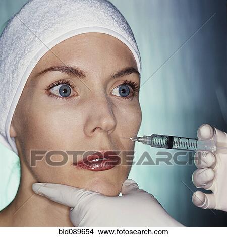 Mixed race woman having facial injection View Large Photo Image Picture - Mixed race woman having facial injection. Fotosearch