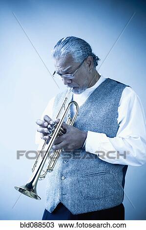 Stock Image - Musician playing trumpet. Fotosearch
