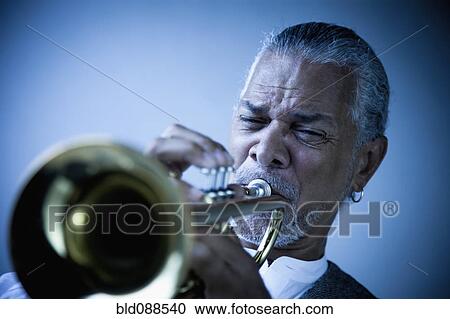 Musician playing trumpet View Large Photo Image Stock Image - Musician playing trumpet. Fotosearch