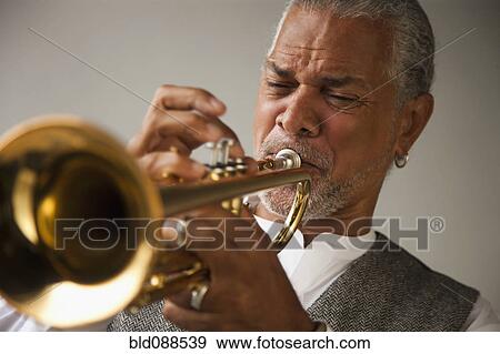 Musician playing trumpet View Large Photo Image Stock Photo - Musician playing trumpet. Fotosearch