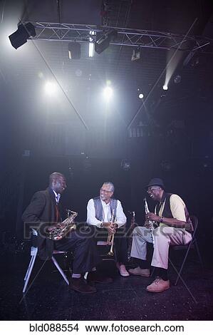 Picture - Musicians playing in jazz band on stage. Fotosearch