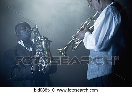 Musicians playing in jazz band on stage View Large Photo Image Stock Image - Musicians playing in jazz band on stage. Fotosearch