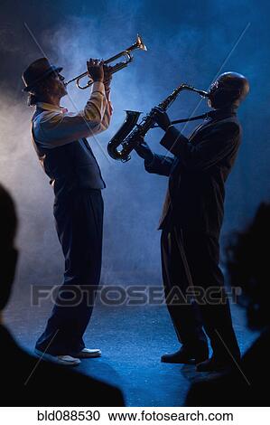 Stock Image - Musicians playing in jazz band. Fotosearch