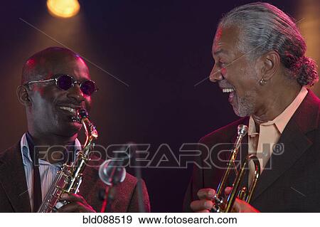 Stock Photo - Musicians playing in jazz band. Fotosearch