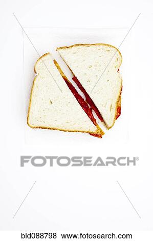 Stock Photo - One peanut butter and jelly sandwich cut in half. Fotosearch
