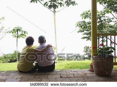 Senior Hispanic couple sitting outdoors together View Large Photo Image Stock Image - Senior Hispanic couple sitting outdoors together. Fotosearch
