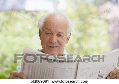Senior Hispanic man reading financial newspaper View Large Photo Image Stock Image - Senior Hispanic man reading financial newspaper. Fotosearch