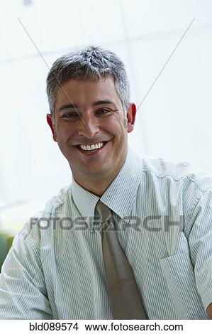 Picture - Smiling businessman. Fotosearch
