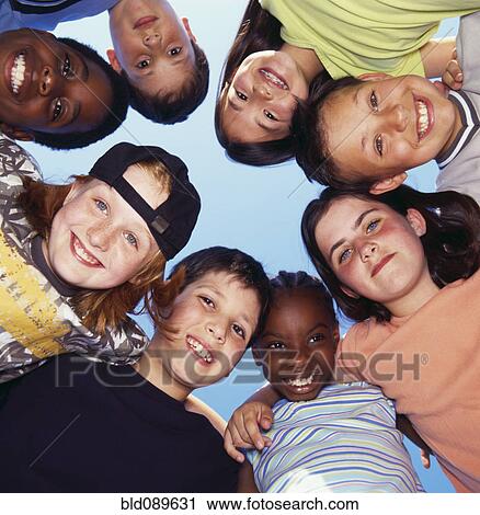 Smiling children hugging in circle View Large Photo Image Stock Image - Smiling children hugging in circle. Fotosearch