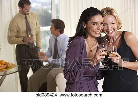 Picture - Smiling couples enjoying party. Fotosearch