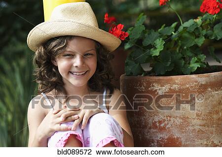 Smiling girl wearing hat View Large Photo Image Stock Image - Smiling girl wearing hat. Fotosearch