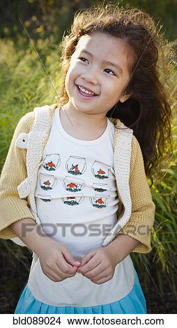 Smiling mixed race girl View Large Photo Image Picture - Smiling mixed race girl. Fotosearch