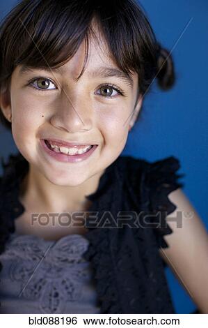 Stock Photograph - Smiling mixed race girl. Fotosearch
