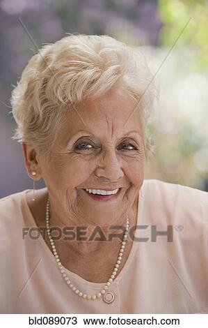 Stock Image - Smiling senior Hispanic woman. Fotosearch