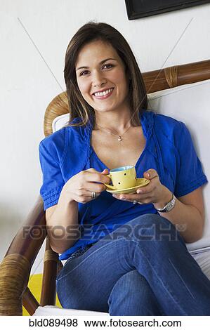 Smiling woman drinking coffee View Large Photo Image Stock Photo - Smiling woman drinking coffee. Fotosearch