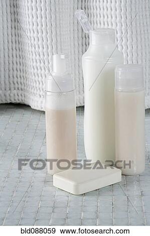 Stock Photo - Soap and bottles shampoo, conditioner and shower gel. Fotosearch