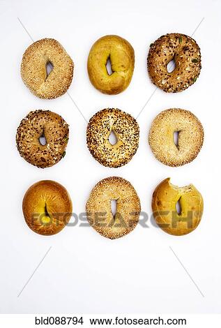 Various bagels, one with bite missing View Large Photo Image Picture - Various bagels, one with bite missing. Fotosearch