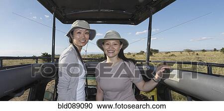 Women riding in truck on safari View Large Photo Image Stock Image - Women riding in truck on safari. Fotosearch