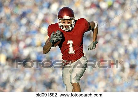 African American football player running on field in game View Large Photo Image Stock Image - African American football player running on field in game. Fotosearch
