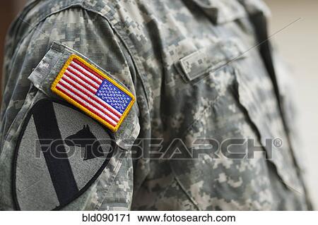 Stock Image - American flag patch on soldier's uniform. Fotosearch